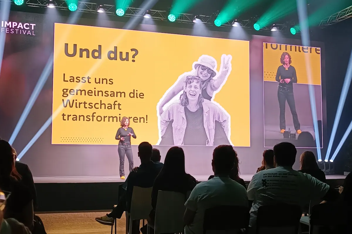 Alma Spribille von WEtell auf der Bühne des Impact Festivals 2024